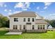 Home's back exterior with patio and grassy yard at 3192 Timber Run Ln, Maiden, NC 28650