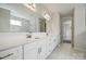 Elegant bathroom with double vanity and marble tile at 3192 Timber Run Ln, Maiden, NC 28650