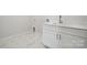 Laundry room with white cabinets and modern sink at 3192 Timber Run Ln, Maiden, NC 28650