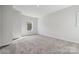 Bright bedroom featuring a large window and plush carpeting at 3192 Timber Run Ln, Maiden, NC 28650
