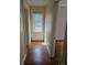 Bright hallway with hardwood floors and a window at 304 Palmer St, Albemarle, NC 28001