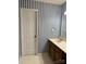 Bathroom with dark blue and white striped wallpaper and double vanity at 106 Dons Ct, Shelby, NC 28150