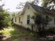 Side view of a white single story home at 719 Mauney Rd, Stanley, NC 28164