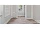Bright bedroom with wood-look floors and built-in shelving at 4319 Hovis Rd, Charlotte, NC 28208