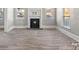 Bright living room featuring hardwood floors and a fireplace at 4319 Hovis Rd, Charlotte, NC 28208