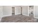 Spacious living area with hardwood floors and access to other rooms at 4319 Hovis Rd, Charlotte, NC 28208