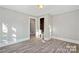 Spacious bedroom with neutral walls and wood-look floors at 4319 Hovis Rd, Charlotte, NC 28208