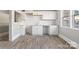 Updated kitchen with white cabinets and new flooring at 4319 Hovis Rd, Charlotte, NC 28208