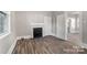Living room with hardwood floors and a fireplace at 4319 Hovis Rd, Charlotte, NC 28208