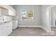 Renovated kitchen featuring white cabinets and granite countertops at 4319 Hovis Rd, Charlotte, NC 28208