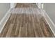 Long hallway with wood-look flooring at 4319 Hovis Rd, Charlotte, NC 28208