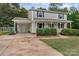 Two-story home with carport, landscaping, and driveway at 511 Colorado Trl, Lincolnton, NC 28092
