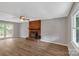 Bright living room with brick fireplace, hardwood floors and access to deck at 511 Colorado Trl, Lincolnton, NC 28092