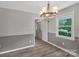 Bright dining room features hardwood floors and a chandelier at 511 Colorado Trl, Lincolnton, NC 28092