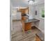 Open kitchen with wood cabinets, island and access to backyard at 511 Colorado Trl, Lincolnton, NC 28092