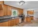 Modern kitchen with wood cabinets, stainless steel appliances, and dark countertops at 511 Colorado Trl, Lincolnton, NC 28092