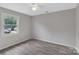 Bright bedroom with wood-look floors and window view at 511 Colorado Trl, Lincolnton, NC 28092