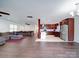 Open concept kitchen with dark wood cabinets and stainless steel appliances at 4616 Canal Rd, Marshville, NC 28103