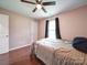 Well lit bedroom featuring wood floors and a ceiling fan at 4616 Canal Rd, Marshville, NC 28103