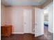 Bedroom with wood flooring and access to other rooms at 4616 Canal Rd, Marshville, NC 28103