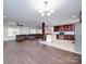 Open concept kitchen with dark wood cabinets and stainless steel appliances at 4616 Canal Rd, Marshville, NC 28103