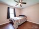 Bedroom with dark wood flooring and window coverings at 4616 Canal Rd, Marshville, NC 28103