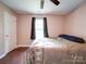 Bright bedroom with wood floors, a window, and a ceiling fan at 4616 Canal Rd, Marshville, NC 28103