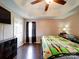 Spacious bedroom with wood floors, large bed, and ceiling fan at 4616 Canal Rd, Marshville, NC 28103