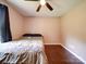 Bedroom with wood floors, a ceiling fan, and a window with curtains at 4616 Canal Rd, Marshville, NC 28103