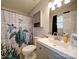Bathroom with a shower/tub, vanity, and turtle-themed shower curtain at 4616 Canal Rd, Marshville, NC 28103