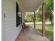 Side porch with two chairs, offering a relaxing space at 4616 Canal Rd, Marshville, NC 28103