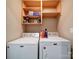 Laundry room with Maytag washer and dryer and additional shelving at 4616 Canal Rd, Marshville, NC 28103