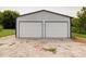 Detached two-car garage with white doors at 4616 Canal Rd, Marshville, NC 28103