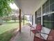 Front porch with two red chairs and yard view at 4616 Canal Rd, Marshville, NC 28103