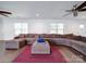 Spacious living room featuring a large sectional sofa and hardwood floors at 4616 Canal Rd, Marshville, NC 28103