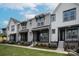 Modern townhouses with gray and white exterior, front yards and walkways at 429 Nathaniel Way # Brx0032, Charlotte, NC 28213