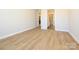 Simple bedroom with hardwood floors and access to bathroom and closet at 1110 Lowland Way, Waxhaw, NC 28173