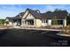 Community center exterior with stone and wood accents, and ample parking at 1110 Lowland Way, Waxhaw, NC 28173