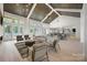 Spacious community room with seating areas, kitchen, and pool view at 1110 Lowland Way, Waxhaw, NC 28173
