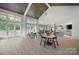 Bright community room with tables, chairs, and a kitchen at 1110 Lowland Way, Waxhaw, NC 28173