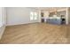 Open concept kitchen boasting gray cabinetry and a large island at 1110 Lowland Way, Waxhaw, NC 28173