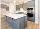 Modern kitchen with gray cabinets, quartz countertops, and island at 1110 Lowland Way, Waxhaw, NC 28173