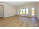Spacious living area featuring hardwood floors and access to backyard at 1110 Lowland Way, Waxhaw, NC 28173