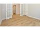 Hardwood floor office with French doors and built-in shelving at 1110 Lowland Way, Waxhaw, NC 28173