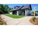 Modern pool house with large garage doors and turf at 1110 Lowland Way, Waxhaw, NC 28173