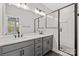 Modern bathroom with gray vanity, double sinks, and a shower at 436 Nathaniel Way # Brx0042, Charlotte, NC 28213