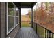 Private deck with wooded views and a metal railing at 440 Nathaniel Way # Brx0041, Charlotte, NC 28213