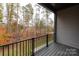 Deck overlooking wooded area with metal railings at 440 Nathaniel Way # Brx0041, Charlotte, NC 28213