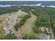 Community overview featuring houses, golf course, and lake at 165 Old Harbor Dr, Mount Gilead, NC 27306