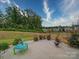 Fenced backyard with patio and play area at 165 Old Harbor Dr, Mount Gilead, NC 27306